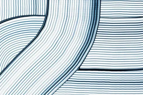 Abstract flowing curved lines in varying shades of blue on white background, creating a wave-like pattern.