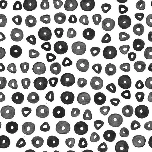 Repeating pattern of black and gray hand-drawn circles and teardrop shapes on white background