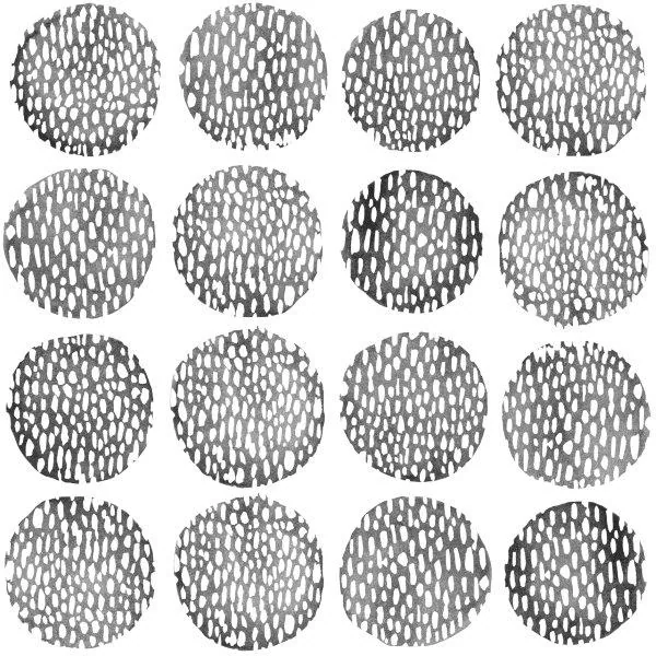 Repeating pattern of gray and white stacked pebbles and stones arranged in circular formations