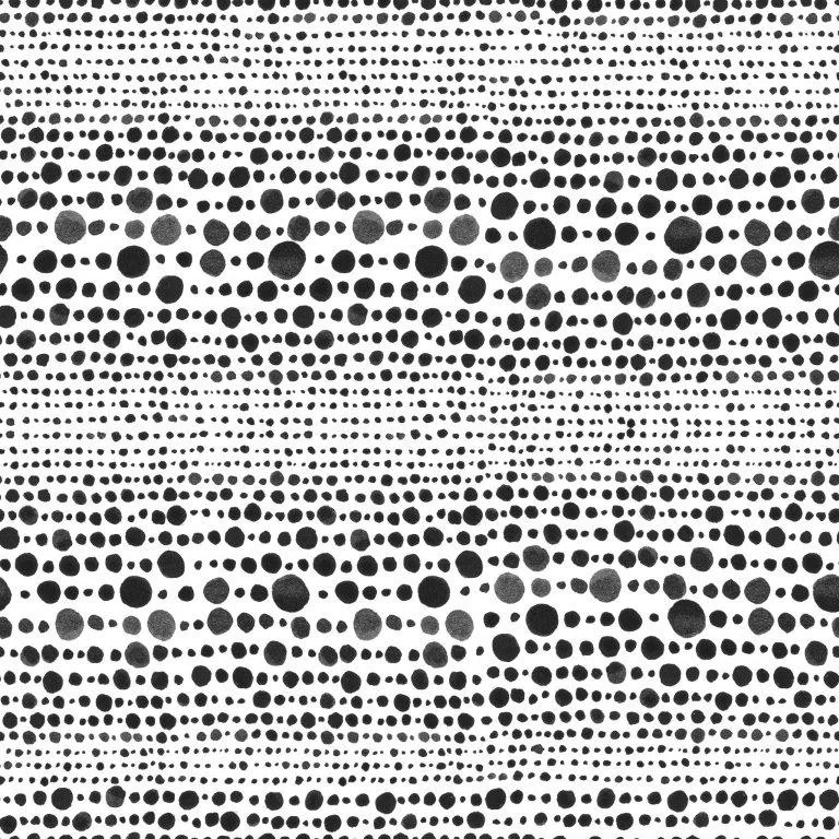 Repeating pattern of randomly sized black dots on white background