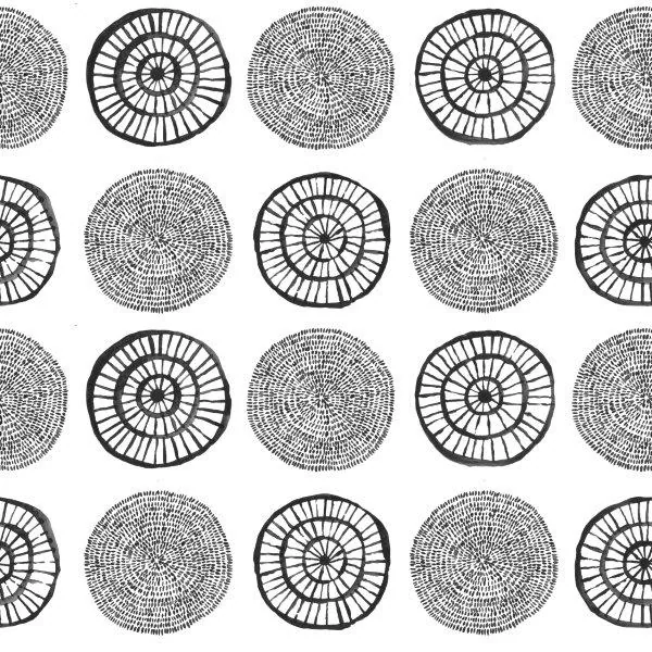 Black and white repeating pattern of concentric circles with radiating line details in boho style