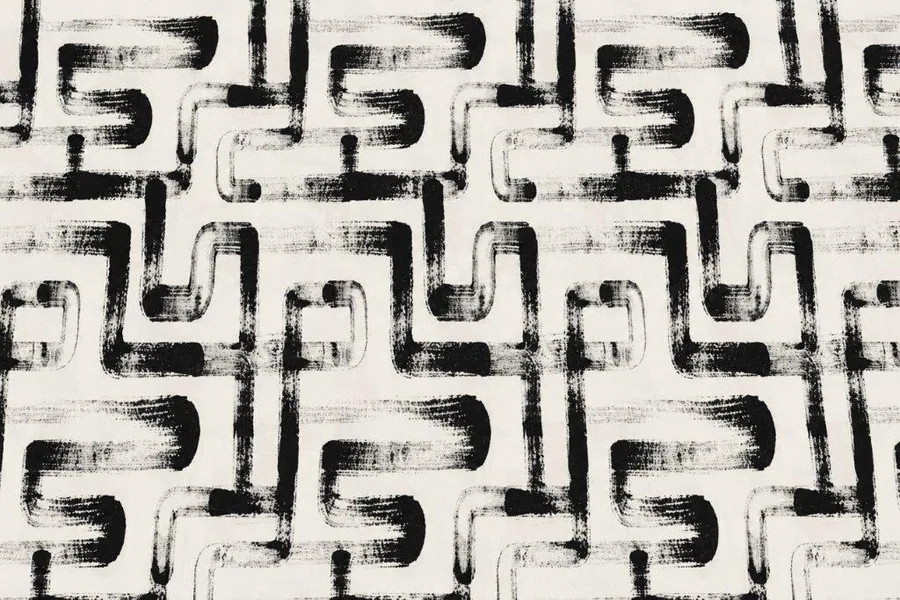 Black and white repeating tribal geometric pattern with interlocking curved lines and angular shapes