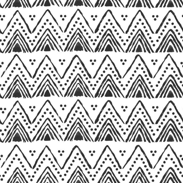 Repeating black and white geometric pattern with nested triangles, dots, and tribal-inspired mountain shapes