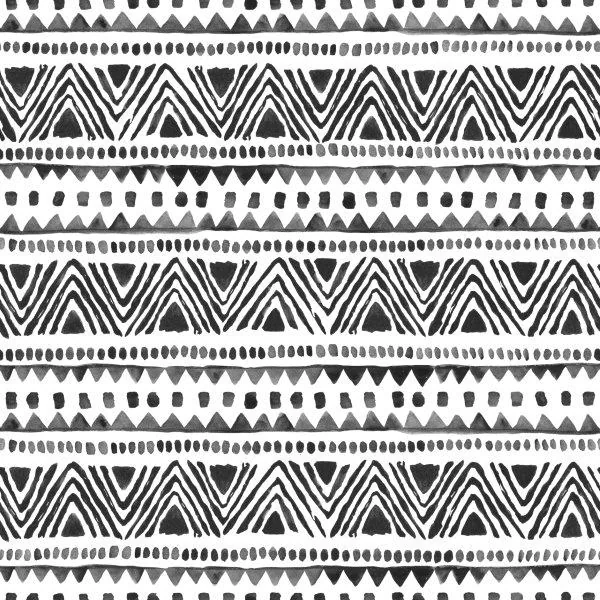 Black and white tribal geometric pattern with repeating chevrons, dots, and triangle motifs