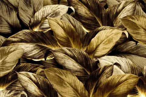 Close-up pattern of dried corn husks in golden and chocolate brown tones with fine striations and natural texture.