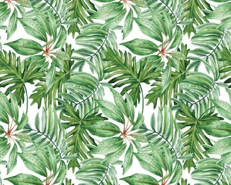 Repeating pattern of green tropical palm and fern fronds with watercolor texture on white background
