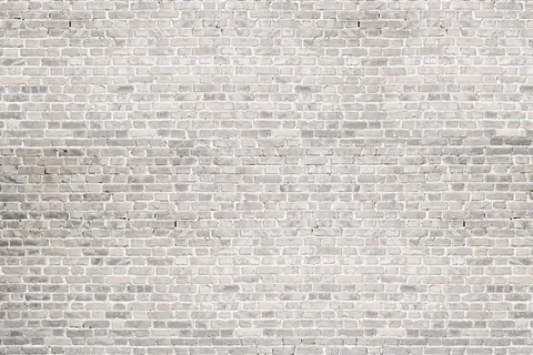 Seamless pale cream and grey brick wall texture with realistic mortar lines and subtle color variation.