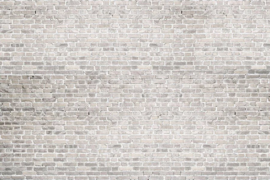 Seamless pale cream and grey brick wall texture with realistic mortar lines and subtle color variation.