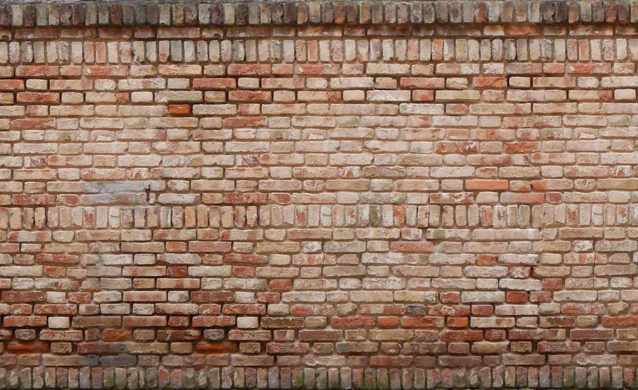 Repeating pattern of aged red and cream brick wall texture with horizontal mortar joints.