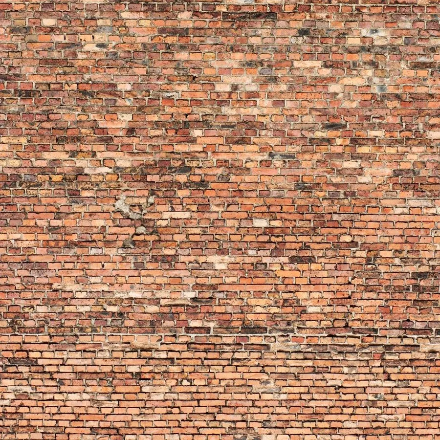 Seamless weathered red and orange brick wall texture with aged mortar joints