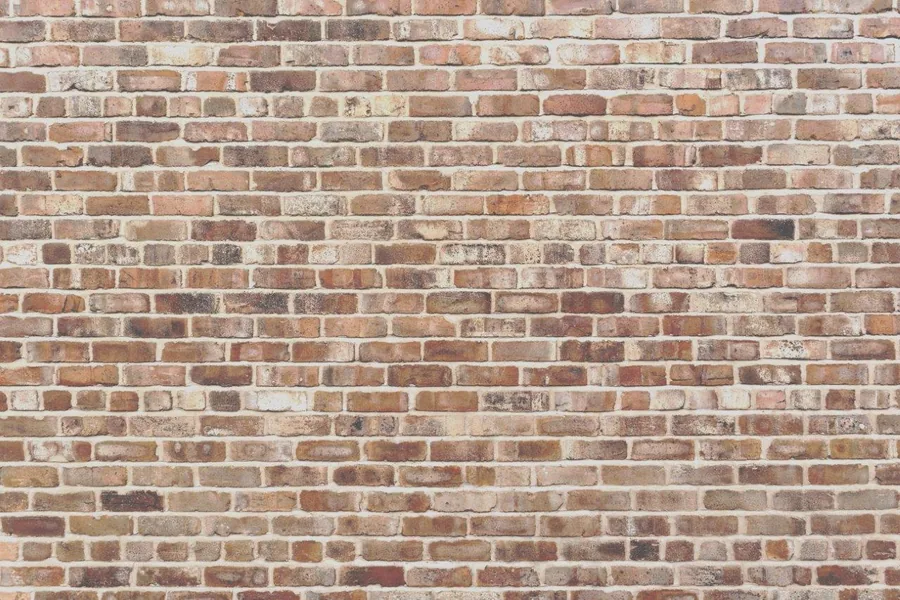 Seamless rustic red and brown brick wall texture with natural weathering and mortar lines.