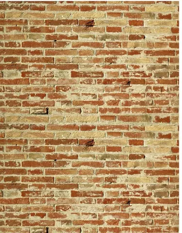 Repeating pattern of rustic red and cream brick wall texture with mortar joints