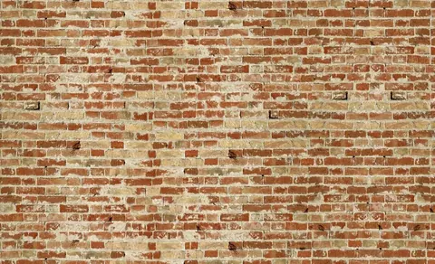 Repeating pattern of rustic red and cream clay bricks with gray mortar joints