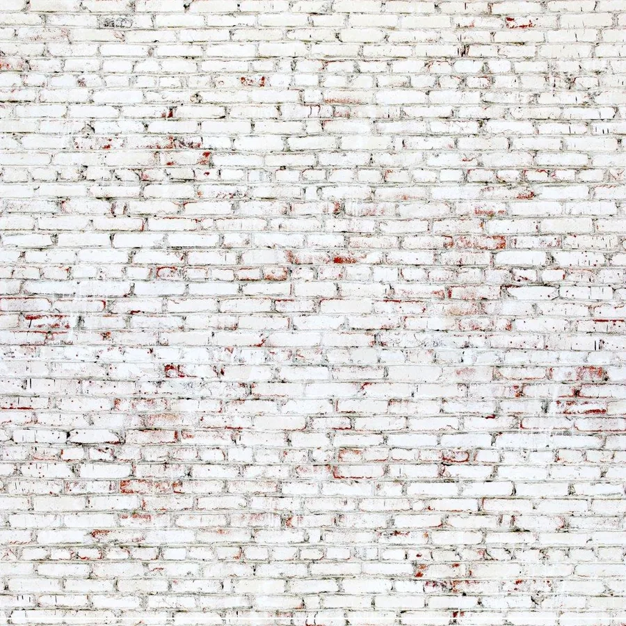 Weathered white painted brick wall with red and rust patina showing age and texture throughout