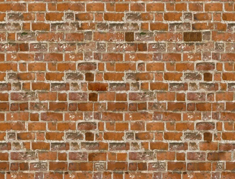 Repeating pattern of weathered red and orange bricks with white mortar and aged patina texture