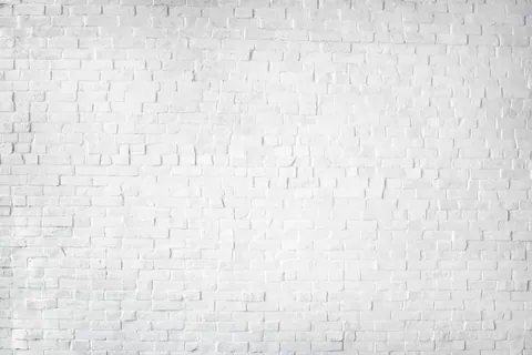White brick wall texture with dimensional relief pattern