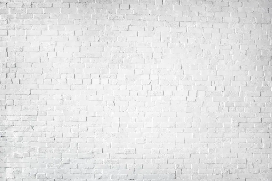 White brick wall texture with dimensional relief pattern