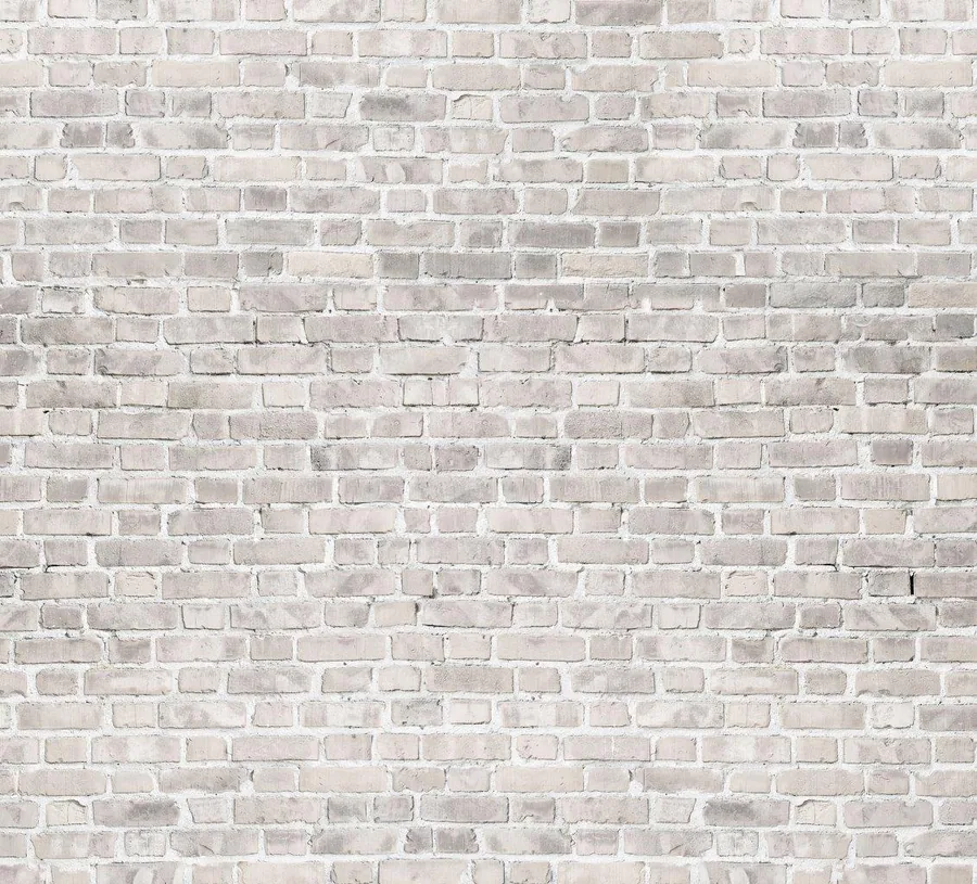 Light cream and beige brick wall texture with white mortar grout lines in regular pattern
