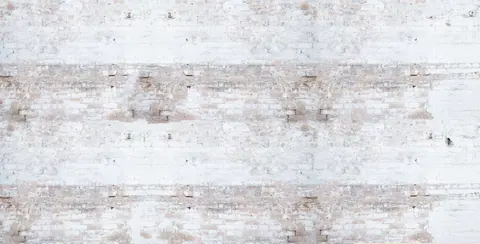 Repeating whitewashed brick pattern with cream and taupe tones and weathered texture