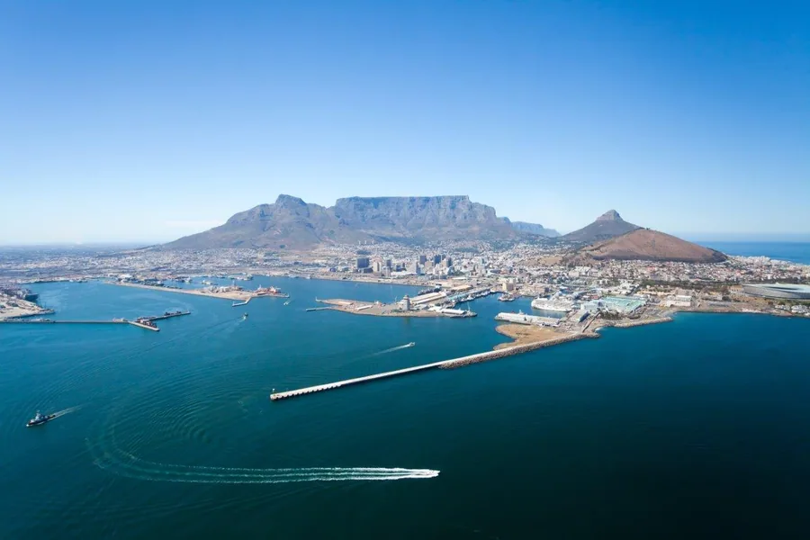 Aerial view of Table Mountain, Cape Town with turquoise waters and coastal cityscape