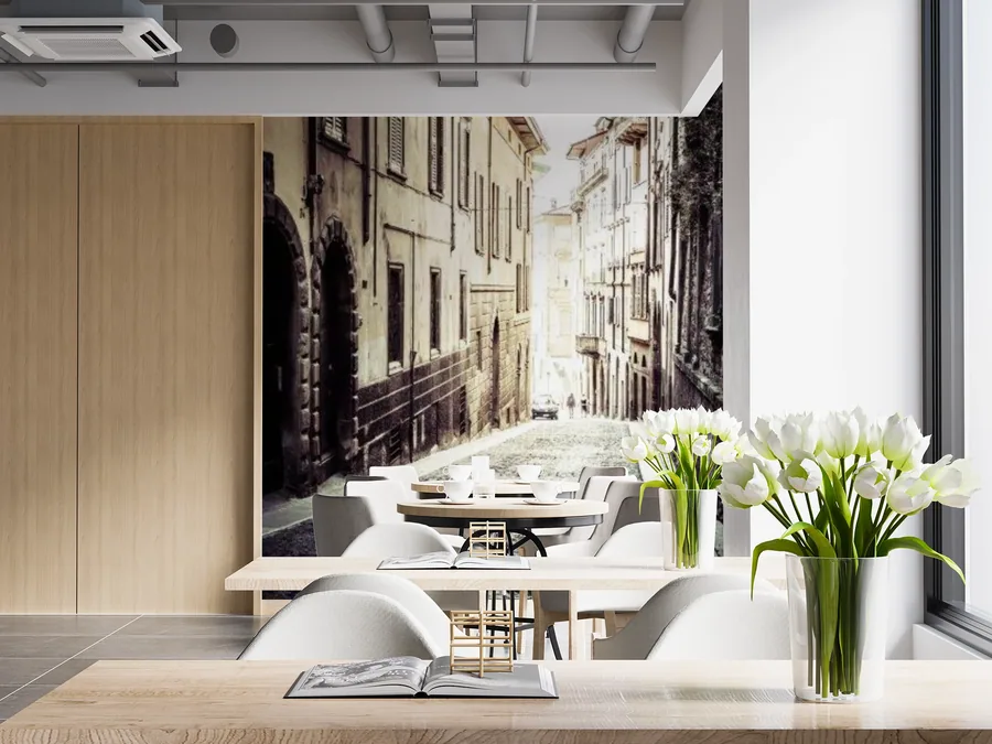 Cities wallpaper shown on a wall in a styled room