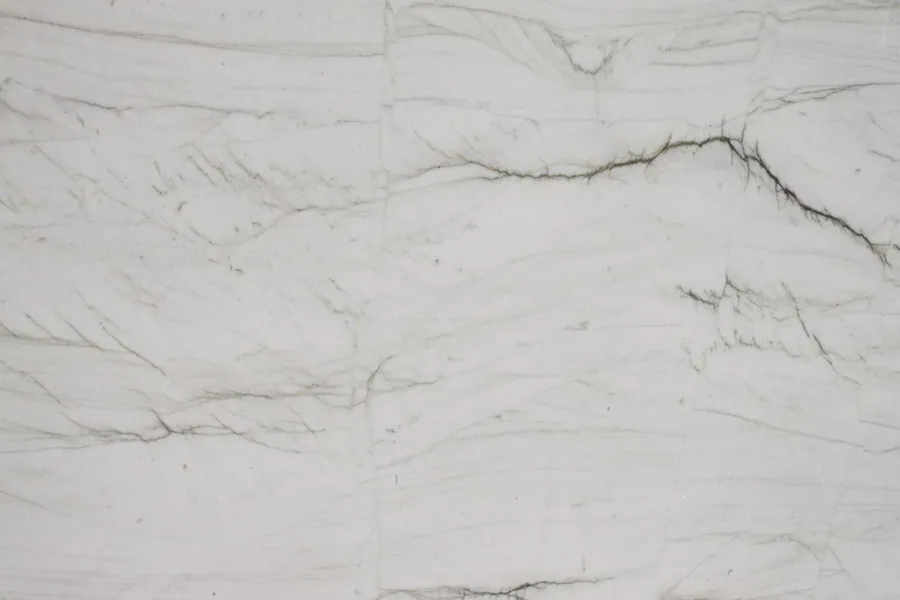 White marble texture with fine grey veining and natural striations throughout.