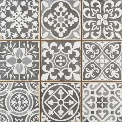 Repeating geometric mosaic tile pattern with ornate floral and cross motifs in gray and white