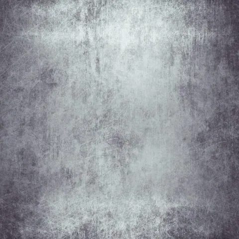 Distressed grey concrete texture with white highlights and vertical streaking patterns