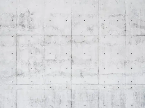 Seamless concrete panel texture with grid lines and weathered finish showing light staining and bolt details.