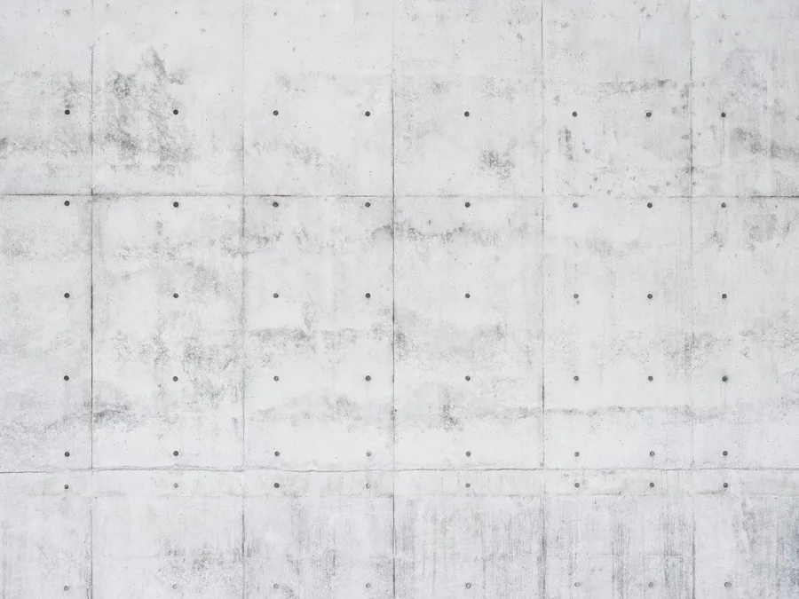 Seamless concrete panel texture with grid lines and weathered finish showing light staining and bolt details.