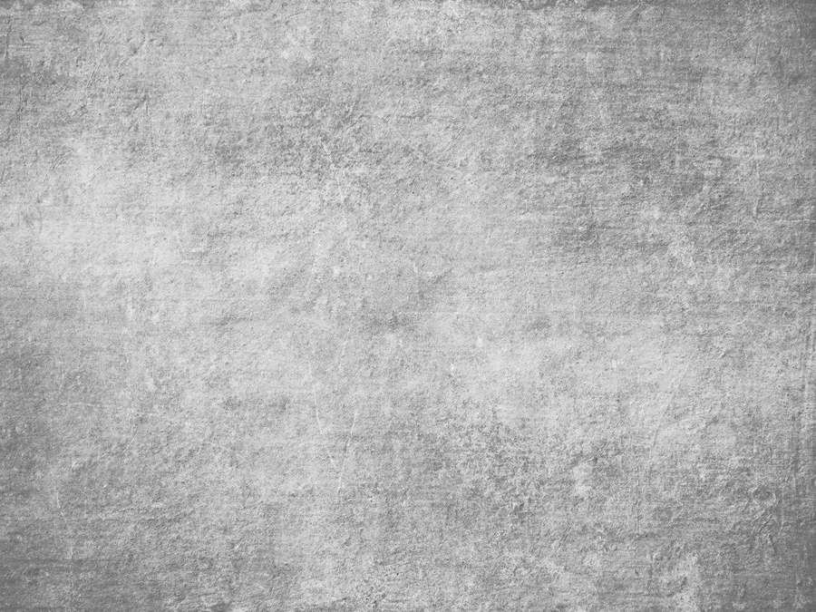 Weathered grey concrete texture with subtle stone-like surface variations and mottled finish.