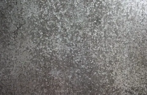 Close-up of weathered concrete texture with mottled grey and white surface finish