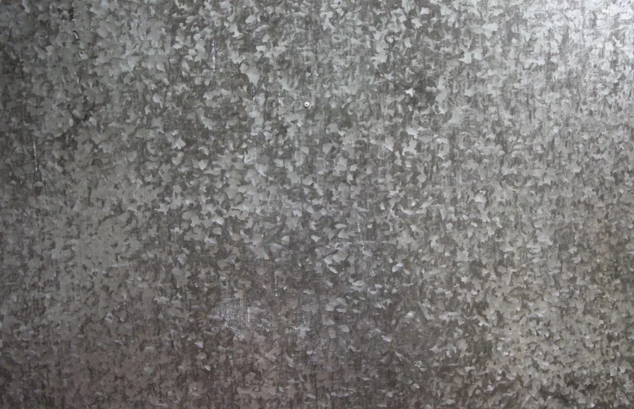 Close-up of weathered concrete texture with mottled grey and white surface finish