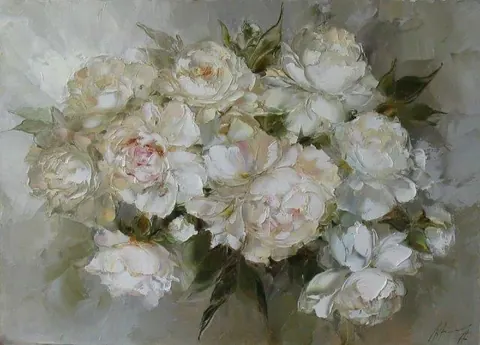 Painterly bouquet of cream and pink peonies with green foliage on soft neutral background.