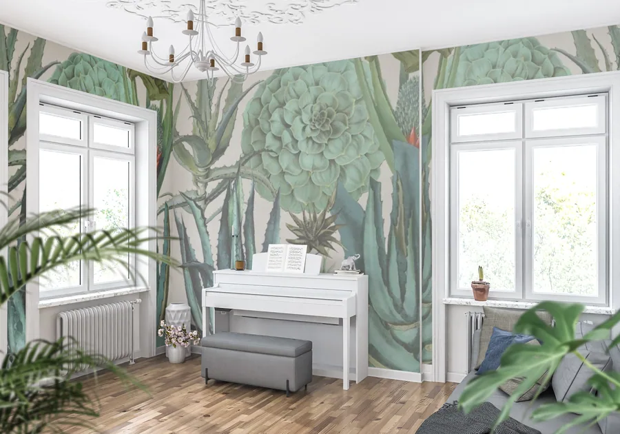 Large-scale cactus and succulent mural in muted greens on cream wall with white piano and windows