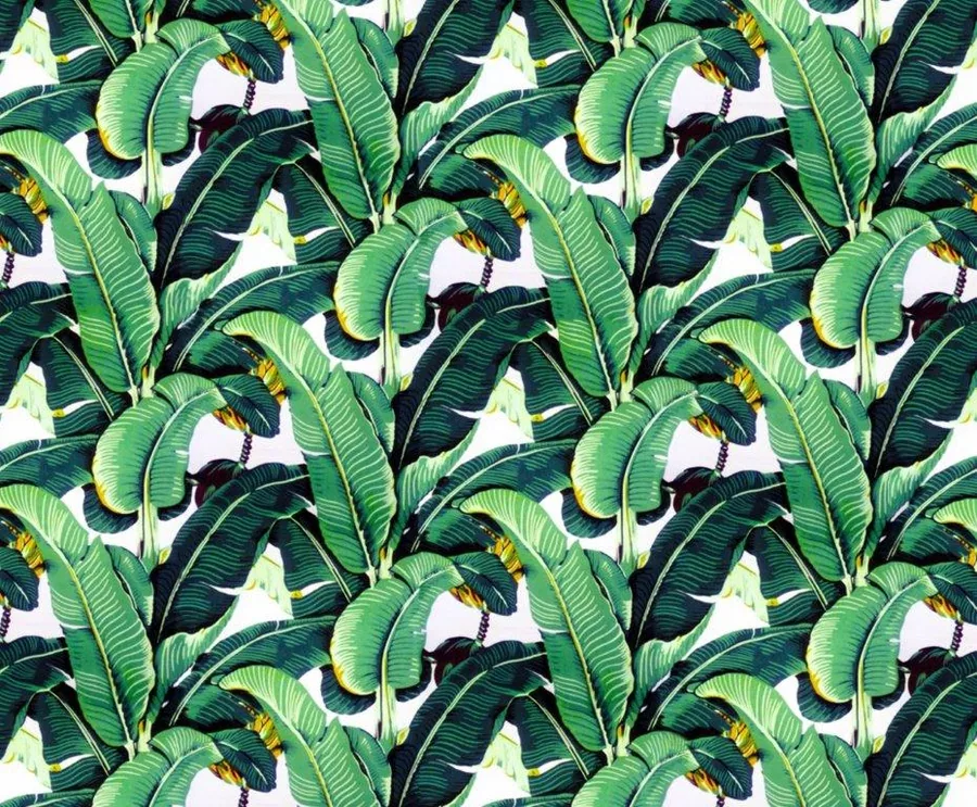 Repeating pattern of large tropical banana leaves in shades of green on white background