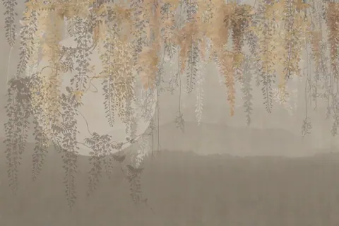 Delicate golden and silver willow branches hanging over a soft, foggy neutral background.