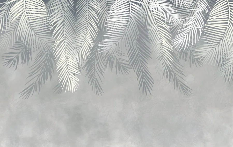 Overlapping palm fronds with linear shadow patterns on a textured grey concrete background.