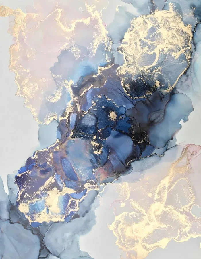 Abstract watercolor marble texture with gold accents and flowing blue-gray washes