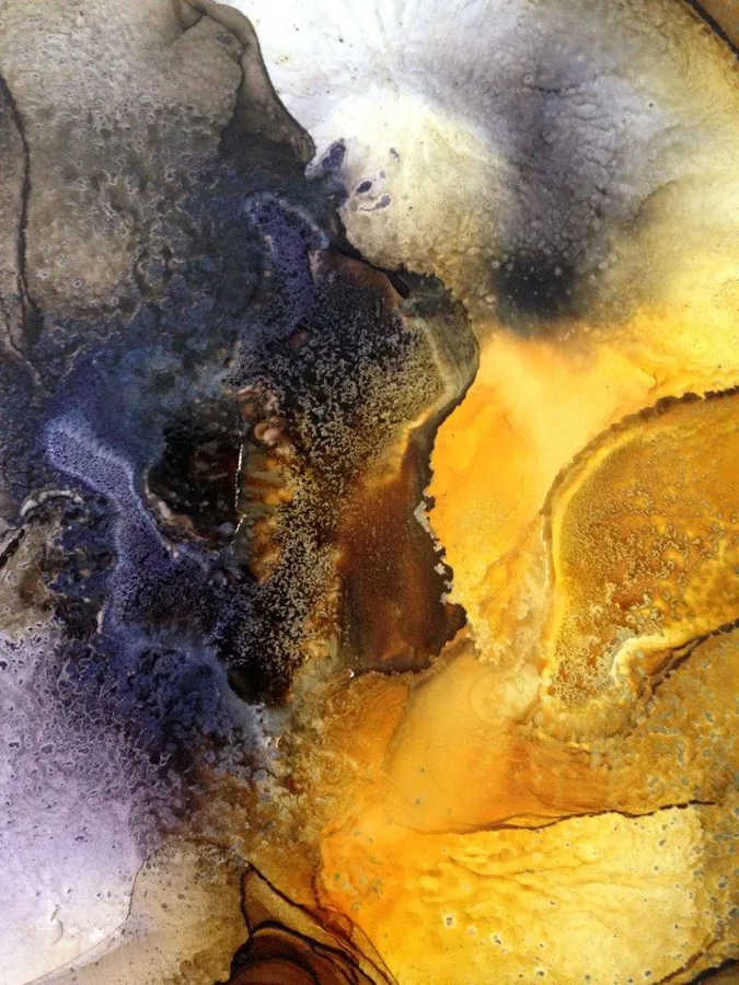 Abstract marble texture with deep blue and golden yellow fluid patterns and metallic accents