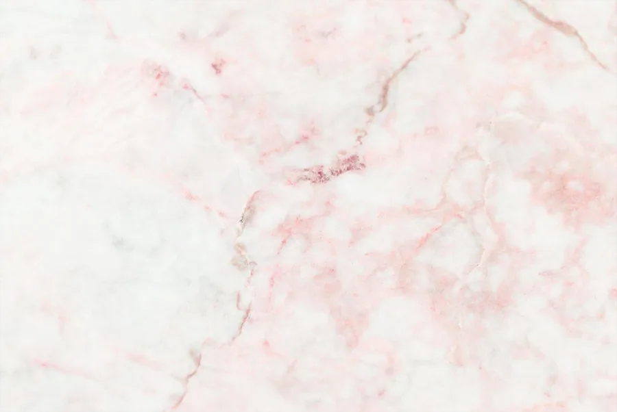 Soft pink and white marble texture with subtle veining throughout