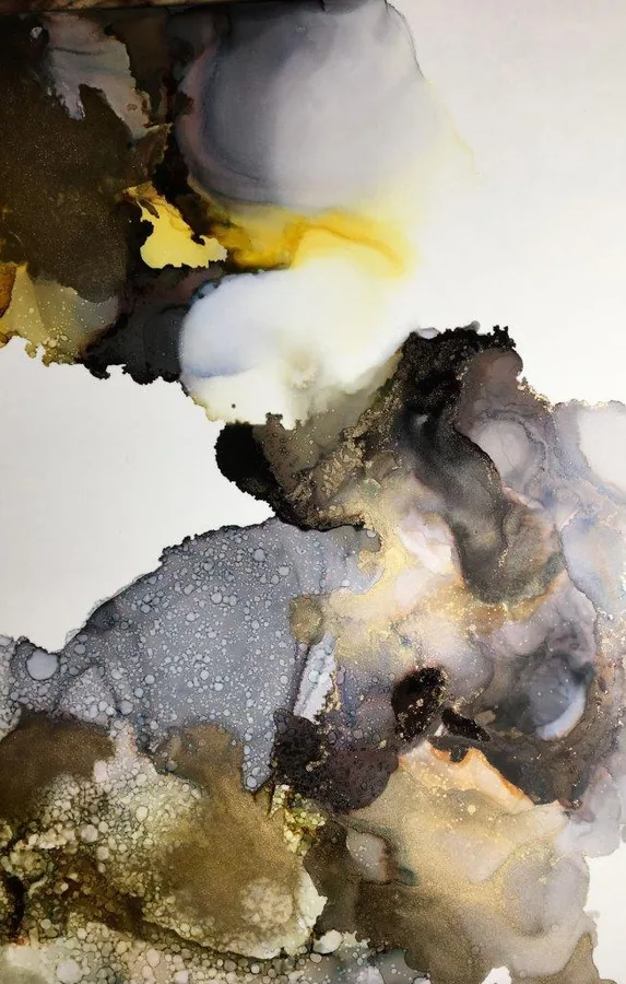 Abstract marble texture with yellow, gray, and white swirling patterns and ink-like flows.