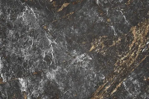 Dark gray stone texture with white and gold metallic veining throughout