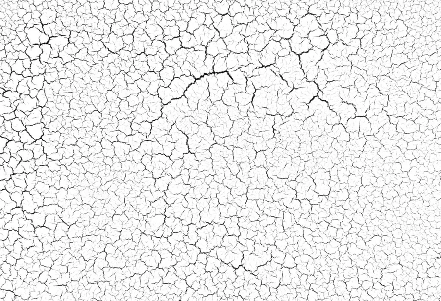 White crackled marble texture with fine cracks creating an aged, weathered surface pattern.