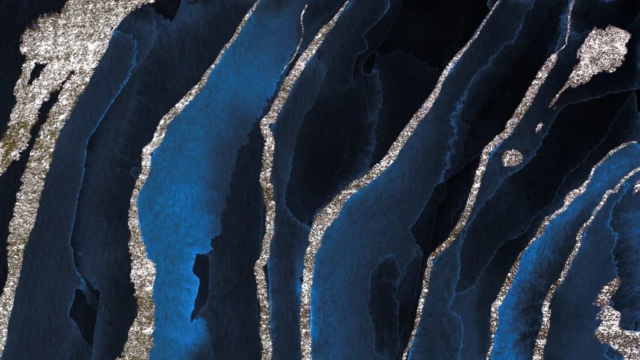 Abstract aerial view of deep blue and black channels separated by shimmering metallic silver borders