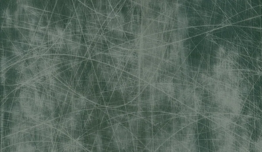 Weathered metal surface with fine scratches and worn texture in grey and sage tones
