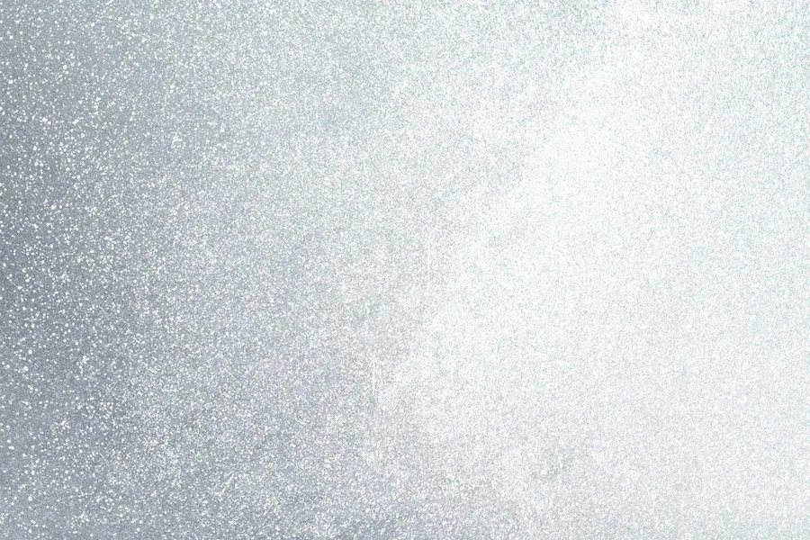 Gradient wallpaper transitioning from dark silver glitter on the left to soft white sparkle on the right