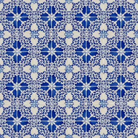 Blue and white ornate mosaic tile pattern with baroque scrollwork in repeating geometric design