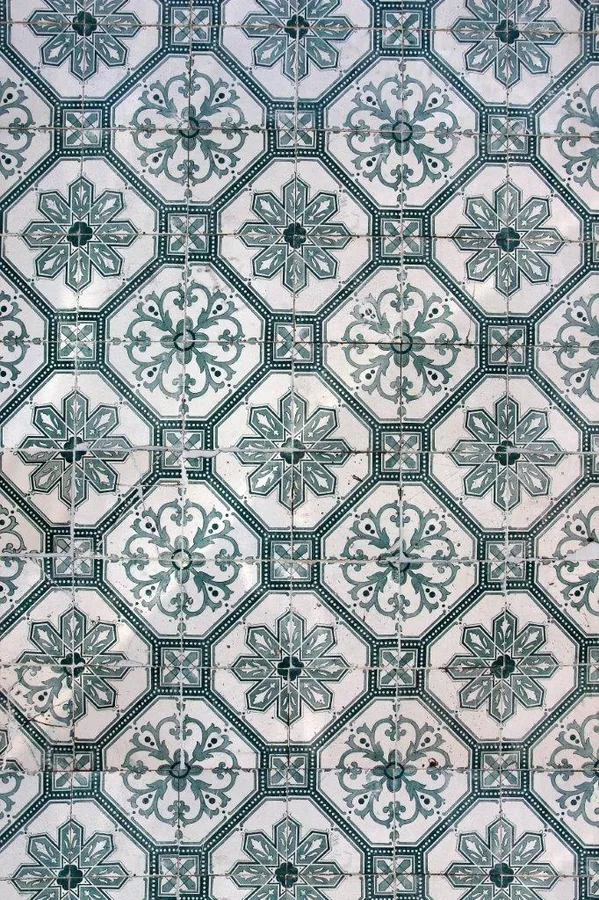 Repeating geometric tile pattern with teal and cream mosaic designs in octagonal and square formations