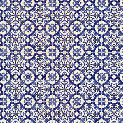 Repeating blue and cream geometric mosaic tile pattern with stars and circular ornaments